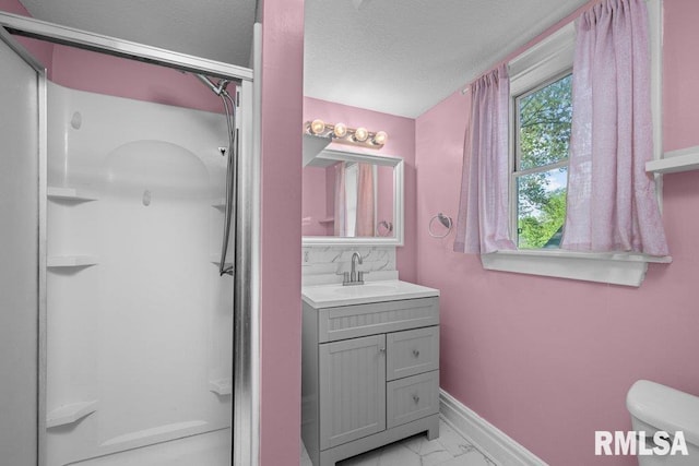 2350 Jefferson Ave, Davenport, IA 52803 - full bathroom with marble finish floors, a shower stall, toilet, baseboards, and a textured ceiling
