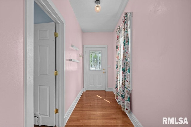 2350 Jefferson Ave, Davenport, IA 52803 - doorway featuring light wood finished floors and baseboards