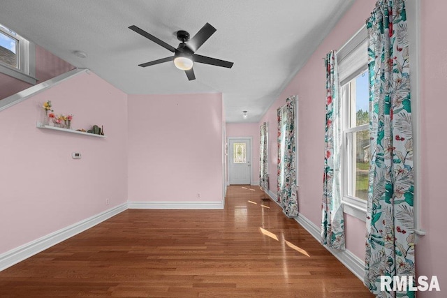 2350 Jefferson Ave, Davenport, IA 52803 - spare room featuring wood finished floors, baseboards, and a ceiling fan