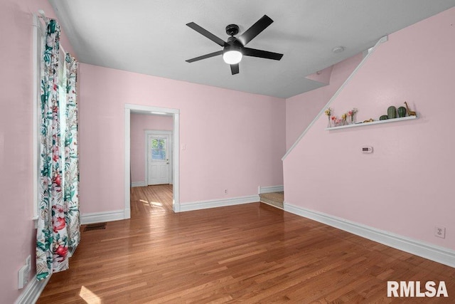 2350 Jefferson Ave, Davenport, IA 52803 - empty room featuring a ceiling fan, wood finished floors, and baseboards