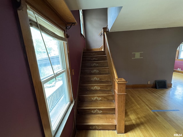 stairway featuring hardwood / wood-style flooring