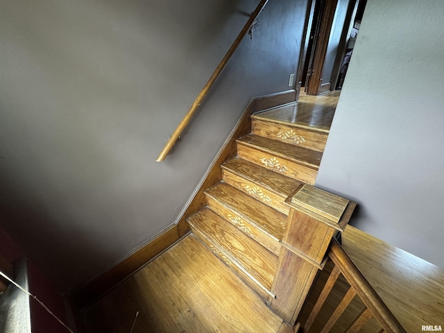 stairs with wood finished floors