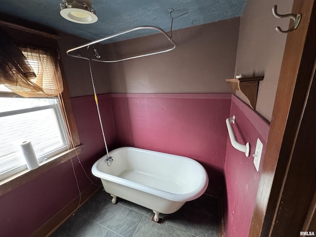 bathroom featuring wainscoting and tile patterned floors