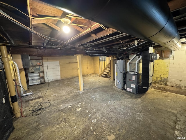 unfinished below grade area with stairway, water heater, and heating unit