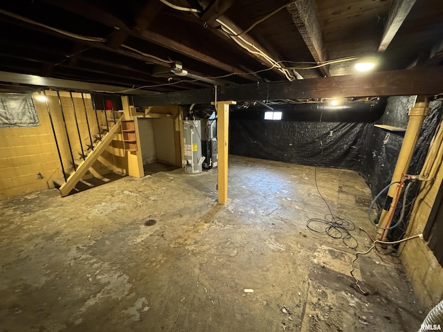unfinished below grade area with water heater and stairway