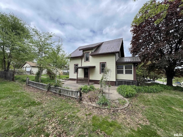 back of property with metal roof
