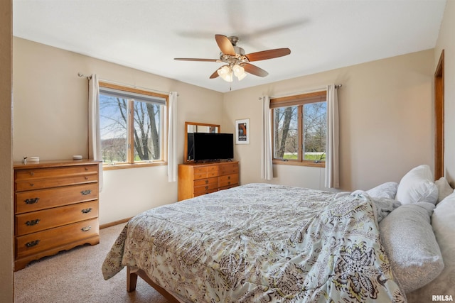 carpeted bedroom with a ceiling fan