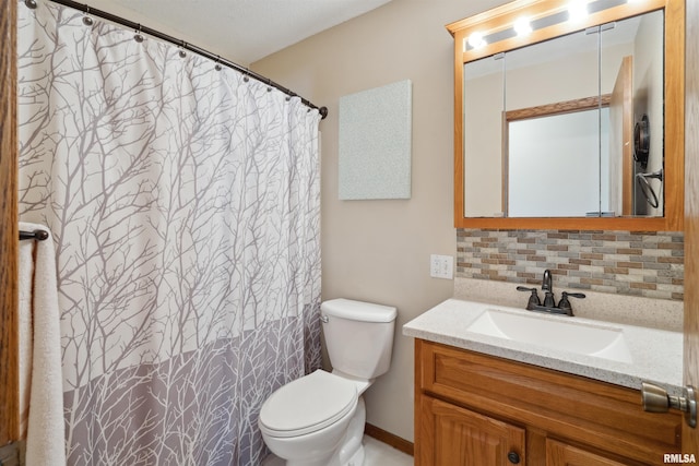 bathroom with tasteful backsplash, toilet, vanity, and curtained shower