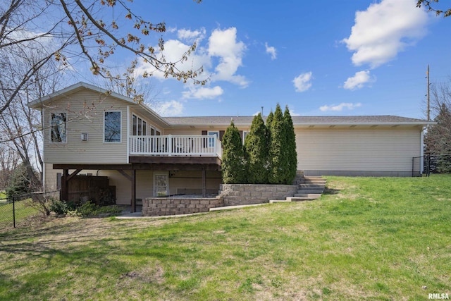 rear view of property featuring a deck