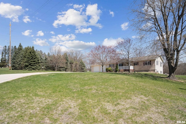 view of front of home with a front lawn and an attached garage