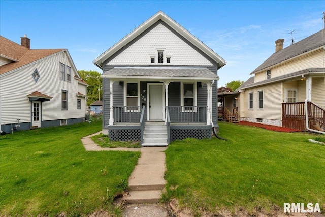 720 Wilkes Ave, Davenport, IA 52802 - view of front of property with a porch and a front lawn