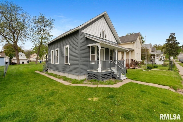 720 Wilkes Ave, Davenport, IA 52802 - view of side of home with covered porch and a yard