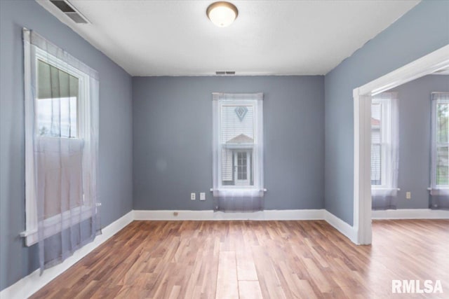 720 Wilkes Ave, Davenport, IA 52802 - spare room featuring wood finished floors and baseboards