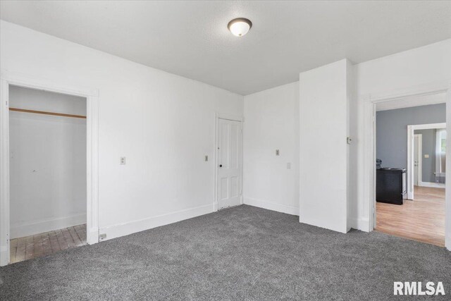 720 Wilkes Ave, Davenport, IA 52802 - unfurnished bedroom featuring carpet floors and baseboards