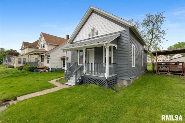 720 Wilkes Ave, Davenport, IA 52802 - view of front of property featuring a front lawn and a porch