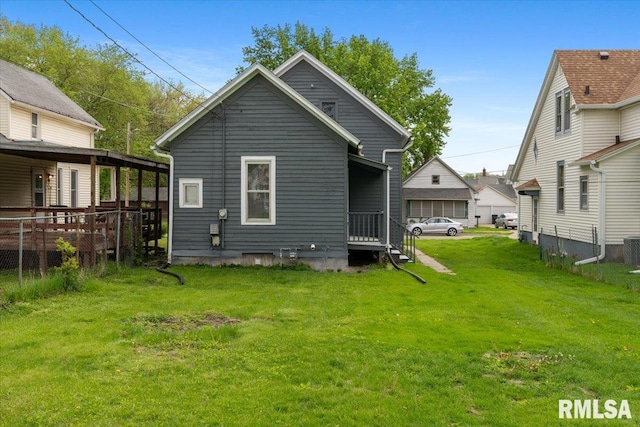 720 Wilkes Ave, Davenport, IA 52802 - rear view of property featuring a yard and cooling unit