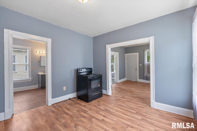 720 Wilkes Ave, Davenport, IA 52802 - empty room with baseboards and light wood finished floors
