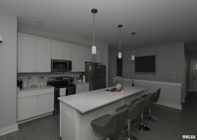 6811 Genesis Way, Bettendorf, IA 52722 - kitchen featuring stainless steel microwave, freestanding refrigerator, electric range, a sink, and white cabinetry