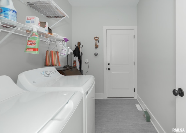 6811 Genesis Way, Bettendorf, IA 52722 - clothes washing area with washer and clothes dryer, baseboards, and carpet floors