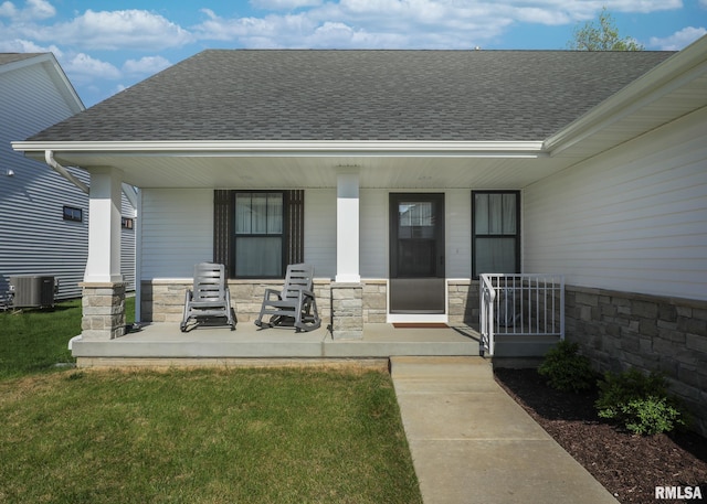 6811 Genesis Way, Bettendorf, IA 52722 - back of house featuring covered porch, roof with shingles, stone siding, and central air condition unit