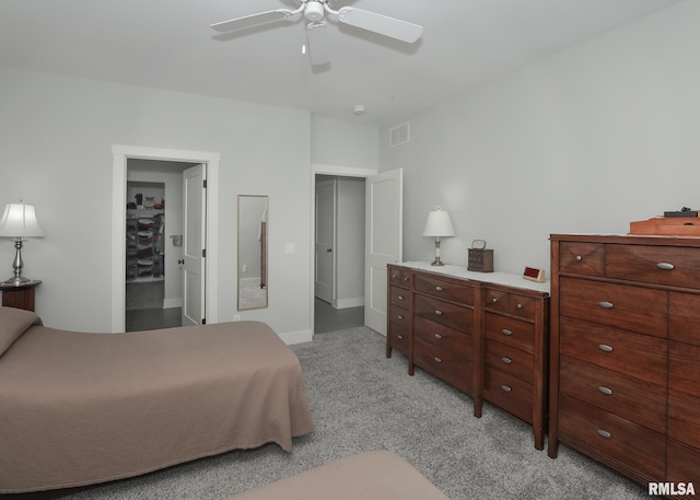 6811 Genesis Way, Bettendorf, IA 52722 - bedroom featuring light carpet and a ceiling fan