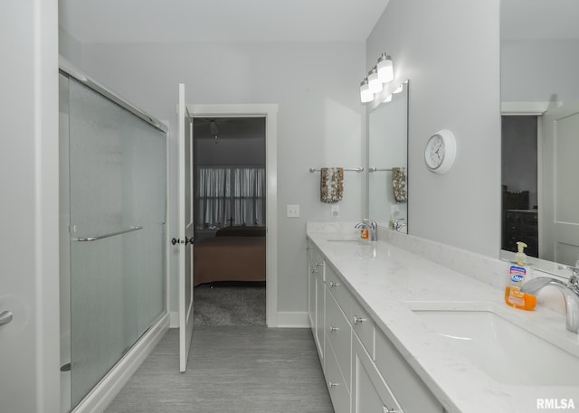 6811 Genesis Way, Bettendorf, IA 52722 - bathroom with a stall shower, double vanity, ensuite bathroom, and baseboards