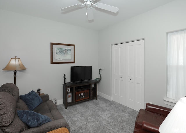 6811 Genesis Way, Bettendorf, IA 52722 - living area with carpet, ceiling fan, and baseboards