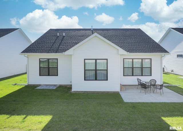 6811 Genesis Way, Bettendorf, IA 52722 - back of property featuring a yard, roof with shingles, and a patio area