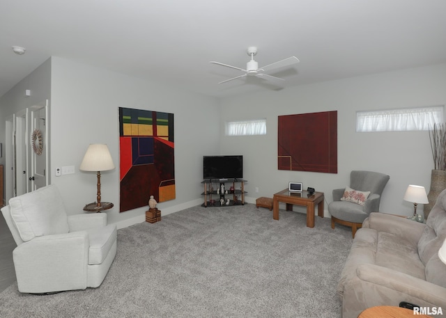 6811 Genesis Way, Bettendorf, IA 52722 - carpeted living area with a ceiling fan and baseboards