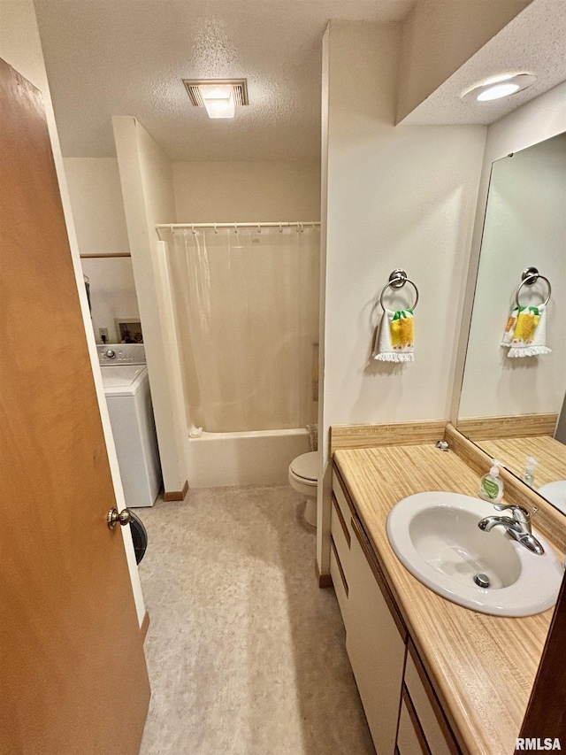 bathroom with washer / dryer, a textured ceiling, vanity, shower / tub combo with curtain, and toilet