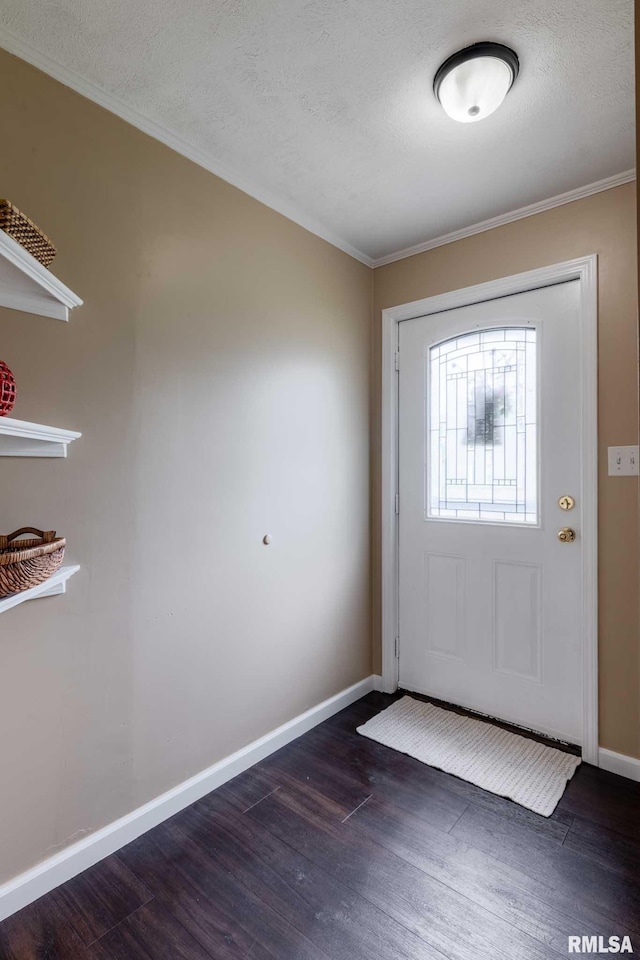 301 N 11th St, Herrin, IL 62948 - entryway featuring dark wood finished floors, crown molding, baseboards, and a textured ceiling
