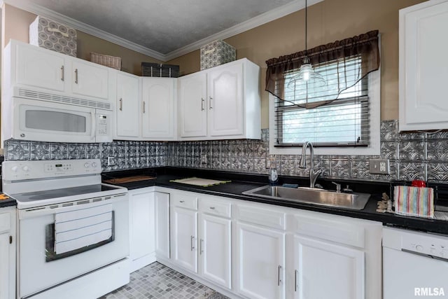 301 N 11th St, Herrin, IL 62948 - kitchen featuring white appliances, dark countertops, a sink, white cabinetry, and backsplash