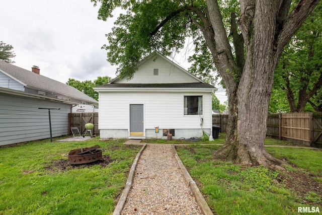 301 N 11th St, Herrin, IL 62948 - rear view of house with a fire pit