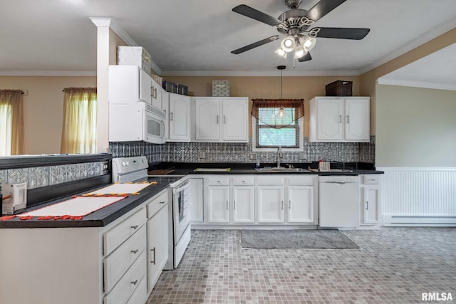 301 N 11th St, Herrin, IL 62948 - kitchen with white appliances, a sink, baseboard heating, dark countertops, and ornamental molding