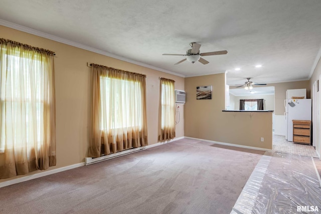 301 N 11th St, Herrin, IL 62948 - unfurnished living room featuring a baseboard heating unit, a ceiling fan, baseboards, ornamental molding, and carpet flooring