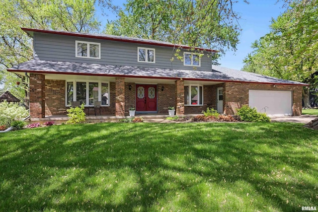 traditional-style home featuring brick siding, a porch, a front lawn, and a garage