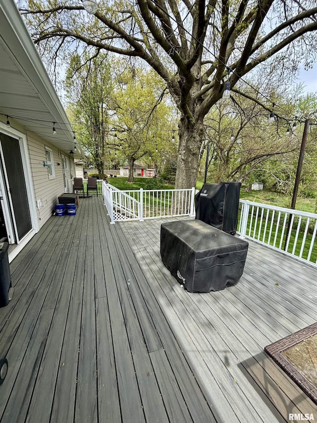 wooden deck with grilling area