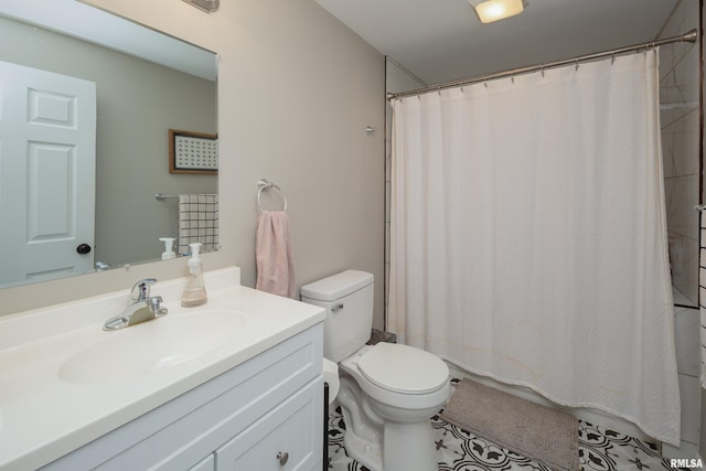 full bath featuring toilet, vanity, and curtained shower