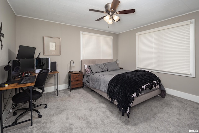 bedroom with carpet, baseboards, ornamental molding, a desk, and ceiling fan