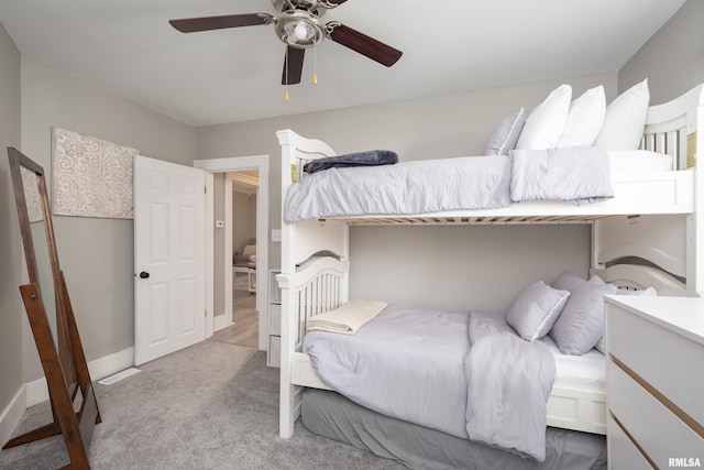 carpeted bedroom with a ceiling fan