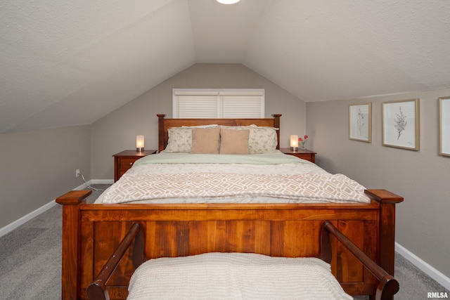 carpeted bedroom featuring vaulted ceiling and baseboards