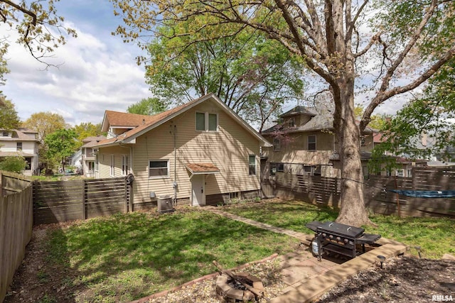 rear view of property featuring central air condition unit