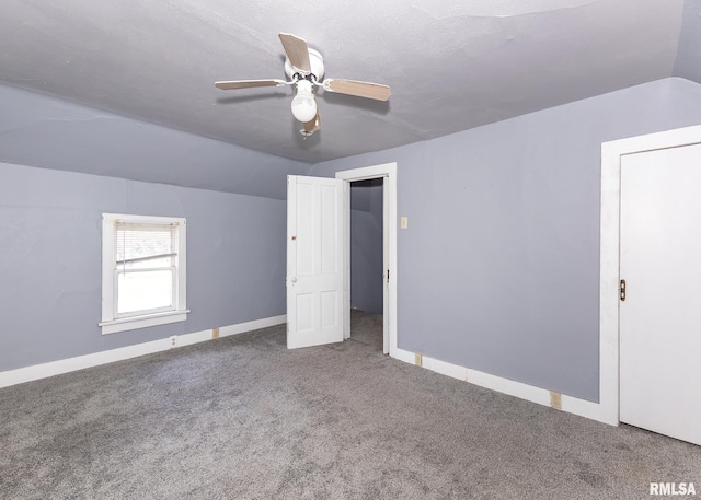 additional living space featuring carpet floors, a ceiling fan, and baseboards