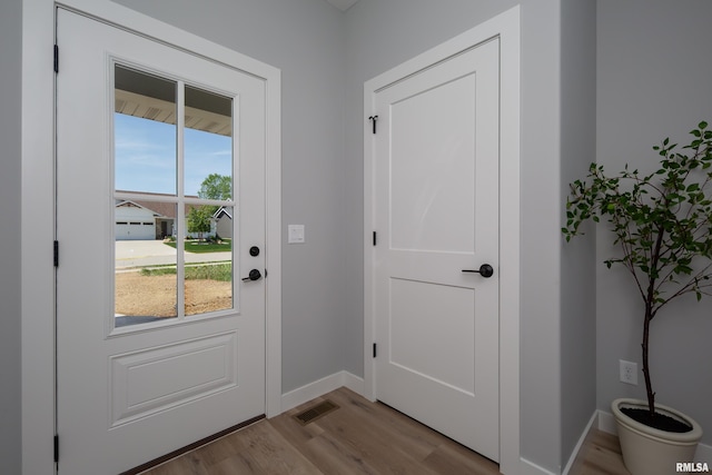 7 Welcome Center Ct, Le Claire, IA 52753 - doorway to outside featuring wood finished floors and baseboards