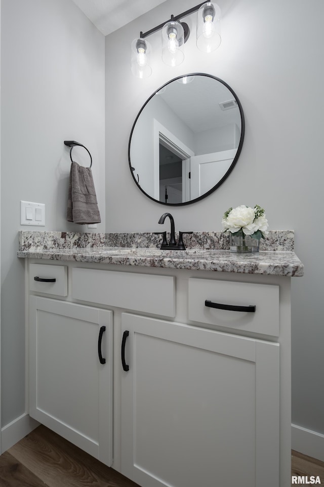 7 Welcome Center Ct, Le Claire, IA 52753 - bathroom featuring vanity and wood finished floors