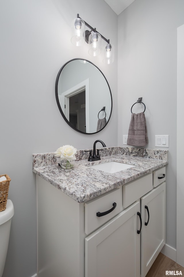 7 Welcome Center Ct, Le Claire, IA 52753 - bathroom featuring vanity and wood finished floors