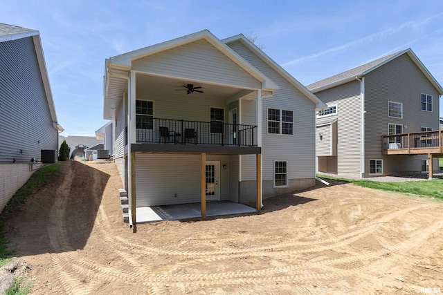 7 Welcome Center Ct, Le Claire, IA 52753 - rear view of property with driveway, a ceiling fan, a patio area, and a balcony