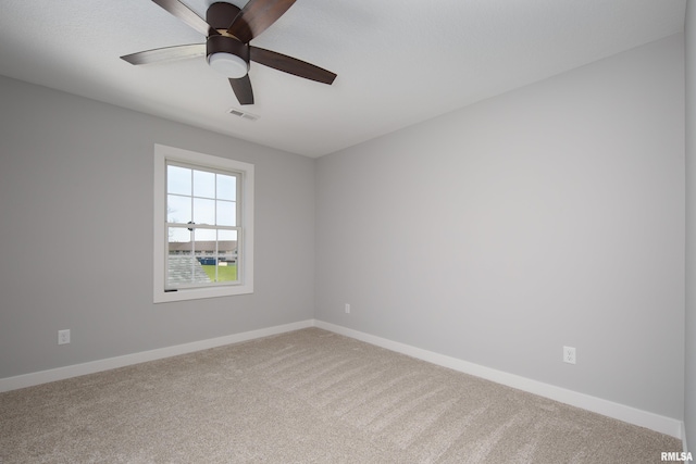 7 Welcome Center Ct, Le Claire, IA 52753 - empty room featuring carpet floors and a ceiling fan