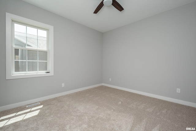 7 Welcome Center Ct, Le Claire, IA 52753 - carpeted spare room featuring a ceiling fan and baseboards