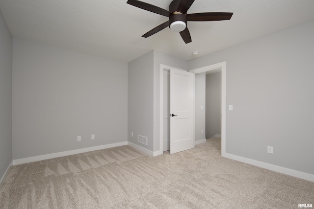 7 Welcome Center Ct, Le Claire, IA 52753 - unfurnished bedroom featuring light carpet and ceiling fan